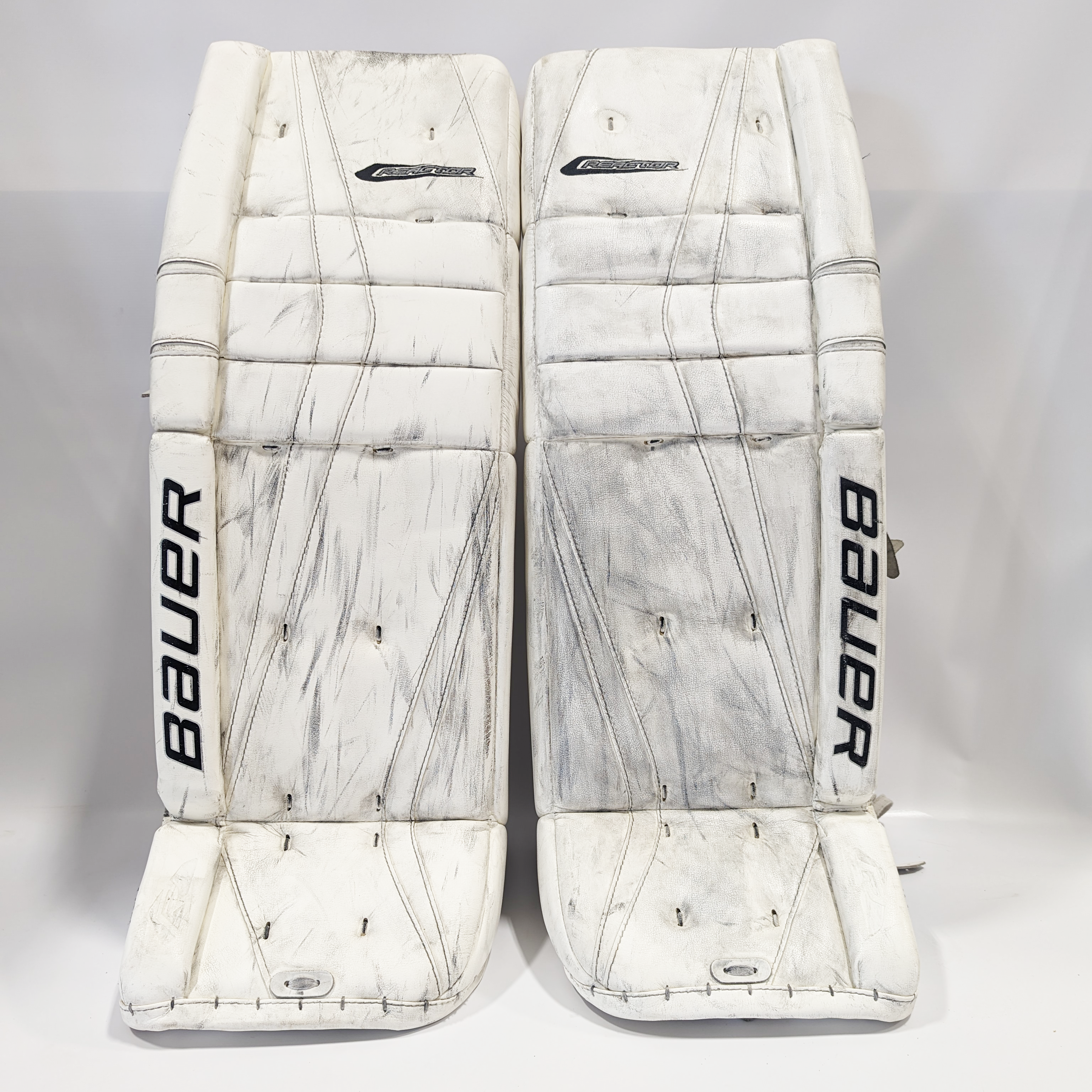 Bauer Reactor 9000 - Jambières de gardien Pro Stock d'occasion (blanches)